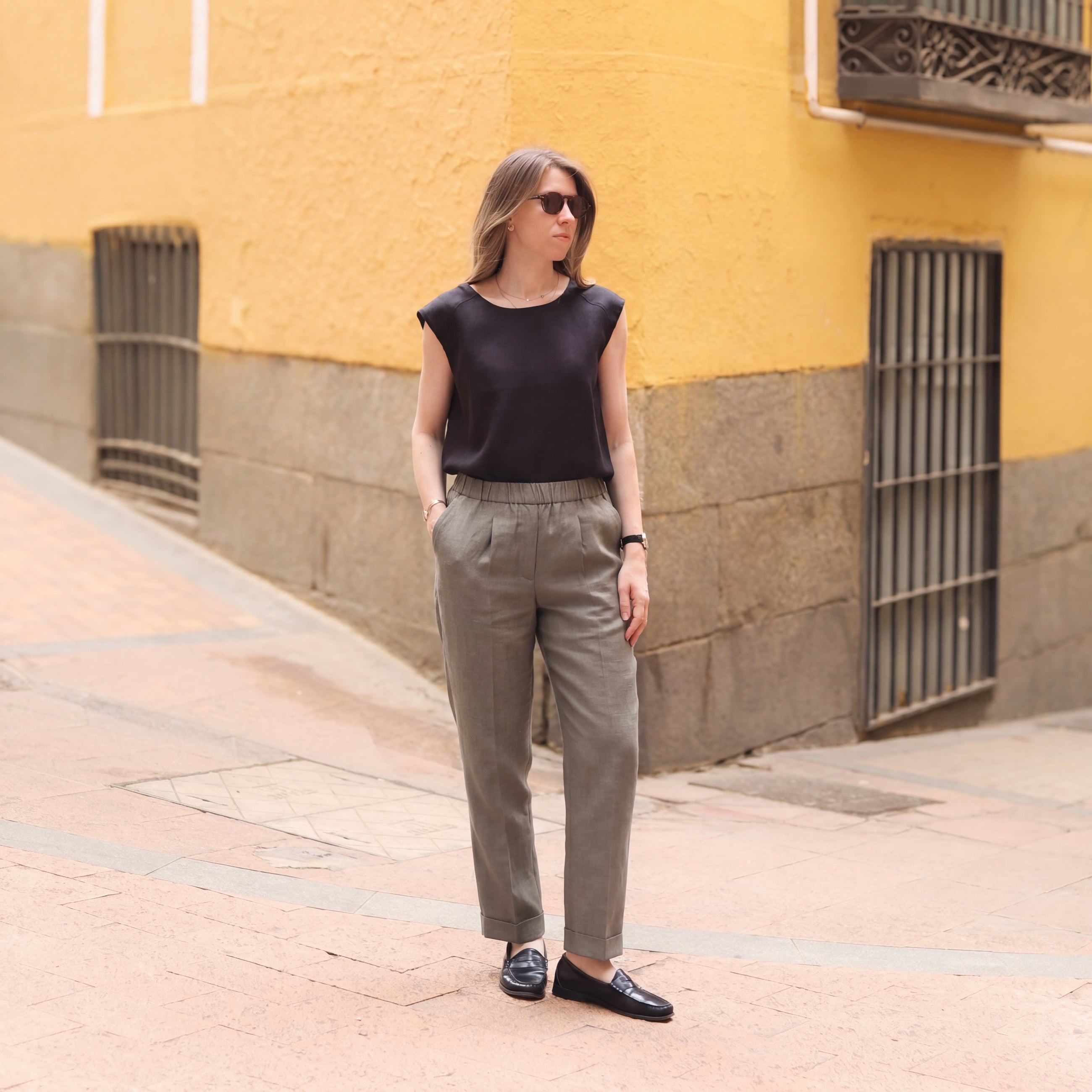 Model wearing Rizvol Smoked Olive linen pants, full look