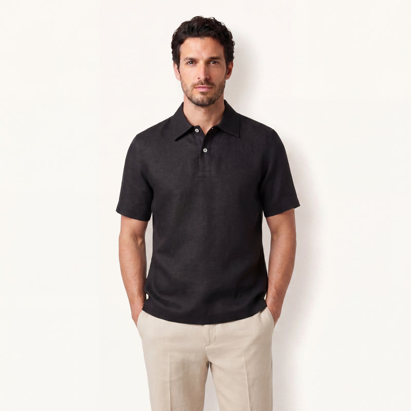 Model wearing obsidian black linen polo shirt