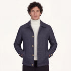 Model wearing Rizvol Aria wool silk linen jacket in navy blue