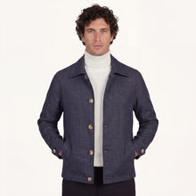 Model wearing Rizvol Aria wool silk linen jacket in navy blue