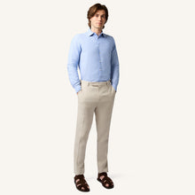 Model wearing Rizvol Salt beige linen trousers front view